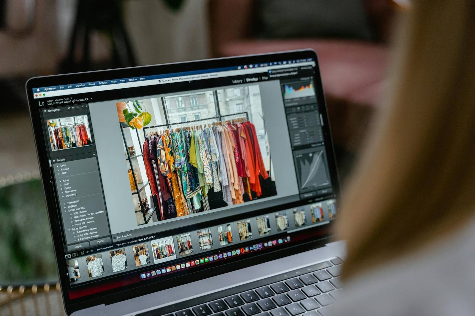 a person editing pictures on a laptop
