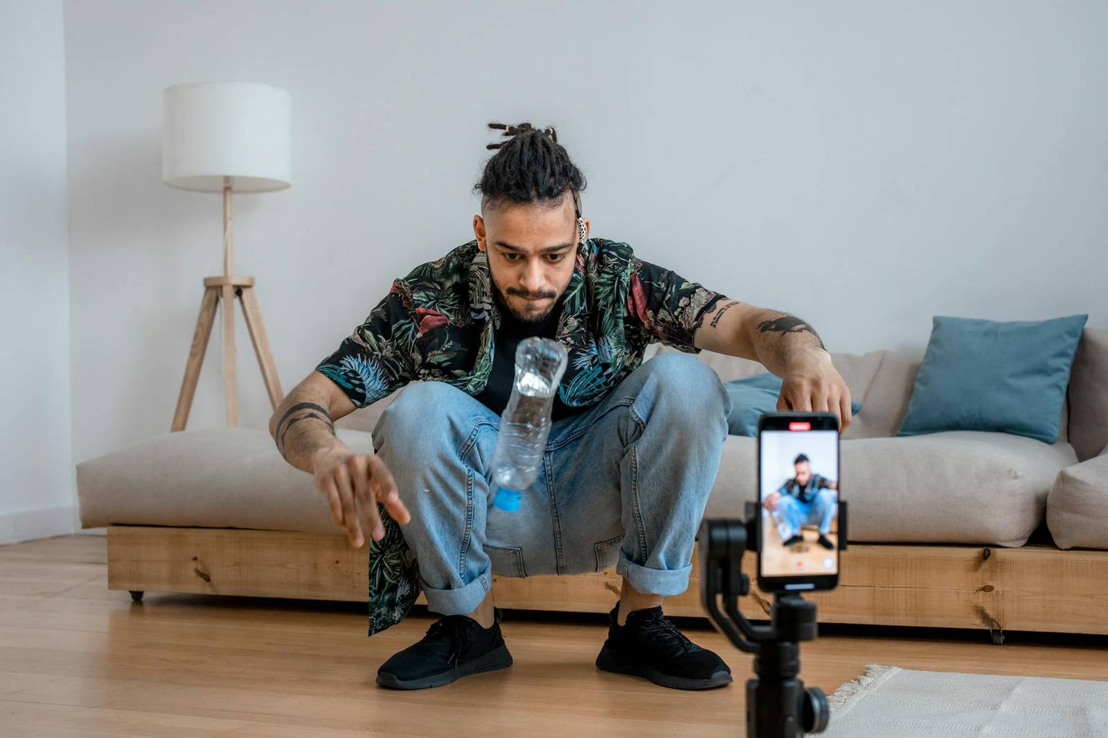 a man doing bottle flip challenge