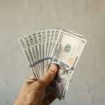hand holding dollars