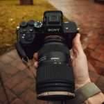 professional dslr camera with telephoto lens outdoors